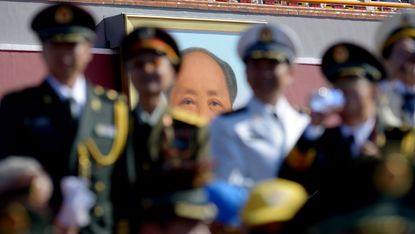 Mao Zedong looms large over a military parade in Tienanmen Square