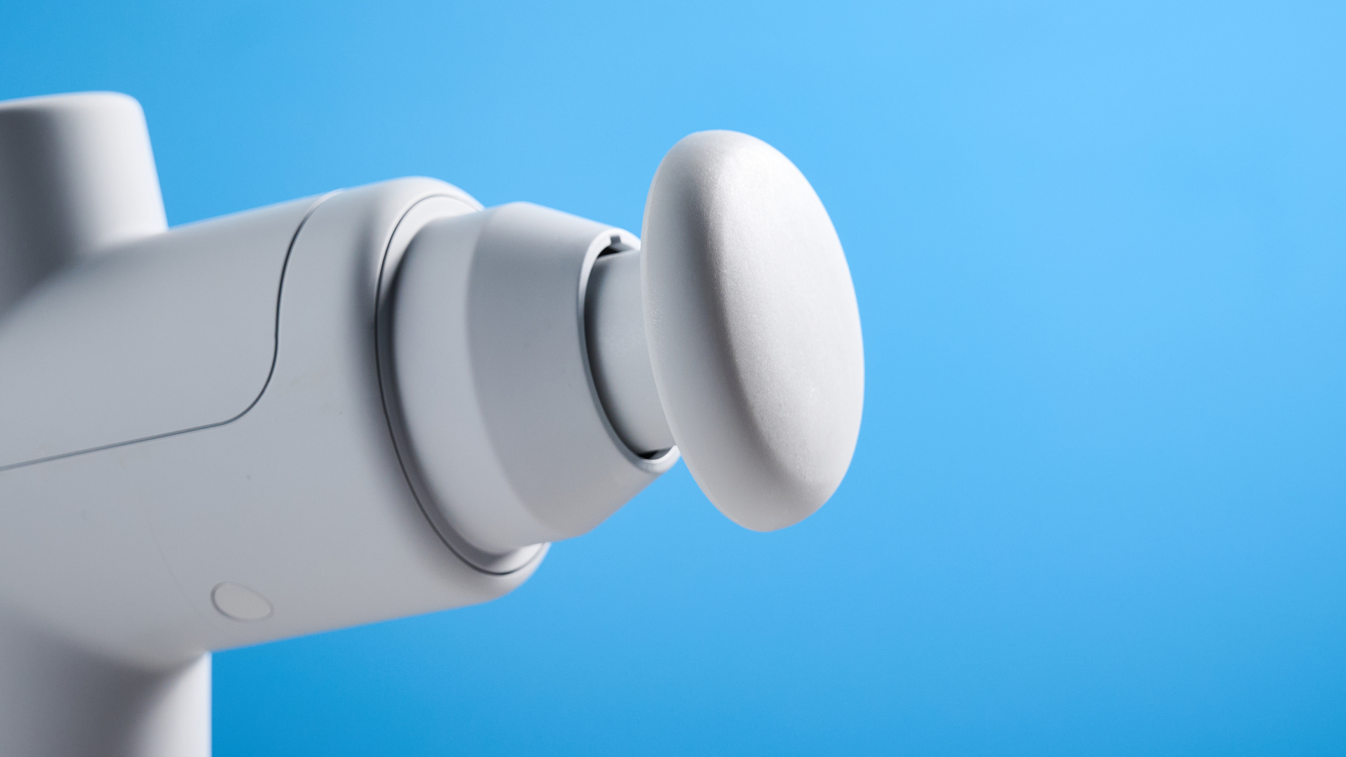 the hyperice hypervolt go 2 massage gun in white/gray with a bullet head attachment, flat head attachment, and a usb-c charging port