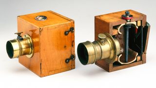 Dubroni wet-plate cameras were the first cameras which allowed the photographic plates to be sensitised, exposed, developed and fixed within the camera body, the chemicals being introduced by means of the rubber bulb and tube. One of these cameras is shown sectioned to reveal the earthenware container encased within it. The camera was very popular in Europe because of its convenience. The name Dubroni is an anagram of the surname of the camera�s patentee, Jules Bourdin (1832-1893). (Photo by SSPL/Getty Images)