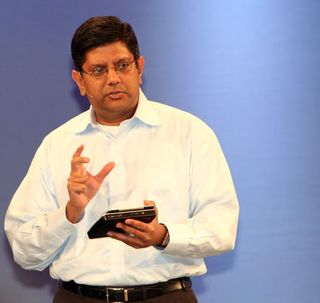 Intel Senior VP Anand Chandrasekher shows off an upcoming ultra mobile computer.