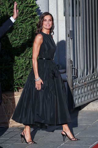Queen Letizia wearing a black long a line dress