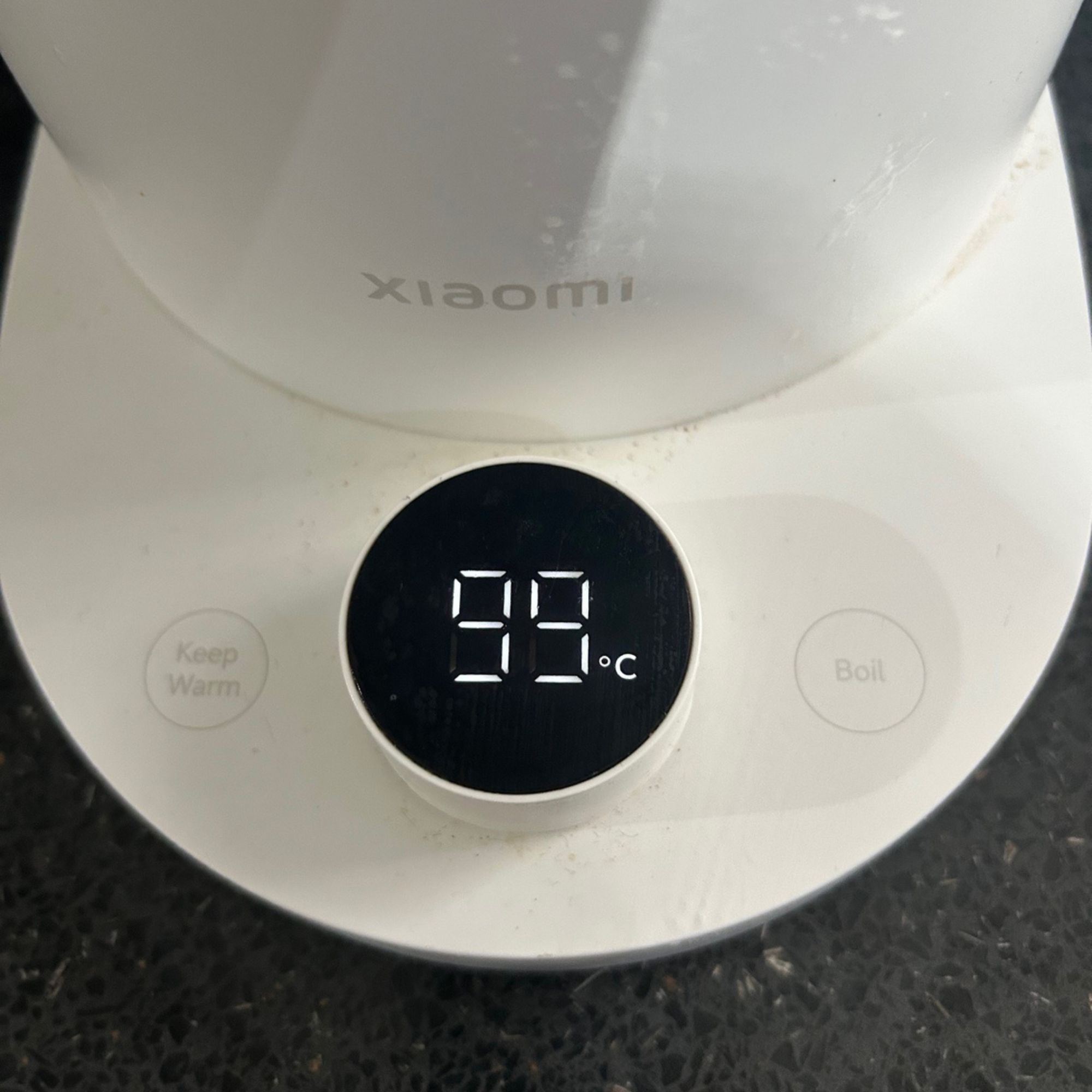 Close up of Xiaomi smart kettle controls on a dark grey worktop