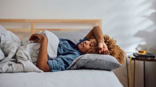 can menopause cause insomnia - woman taking a nap on her bed
