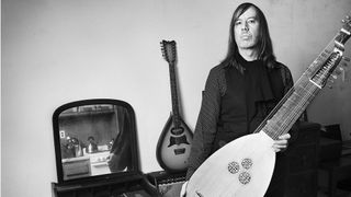 Jozef Van Wissem, composer, stands with his lute in his Greenpoint apartment in Brooklyn, NY on April 3rd, 2014.