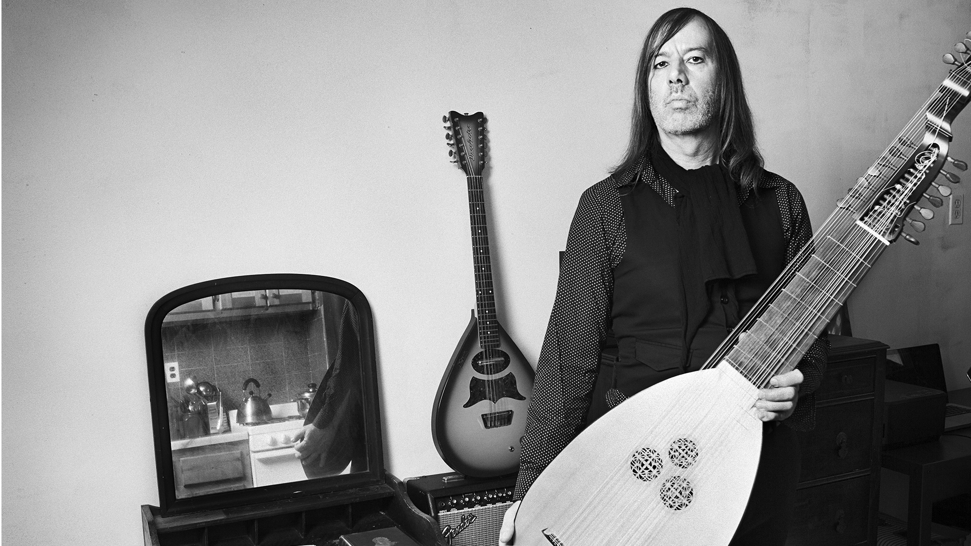 Jozef Van Wissem, composer, stands with his lute in his Greenpoint apartment in Brooklyn, NY on April 3rd, 2014.
