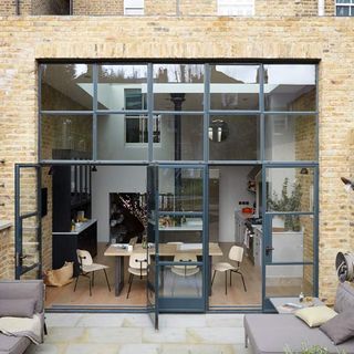 exterior of house with brick wall dinning table chair sofa with cushion