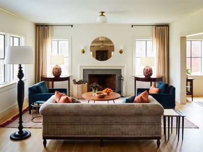 A blue and grey living room with a terracotta-toned coffee table