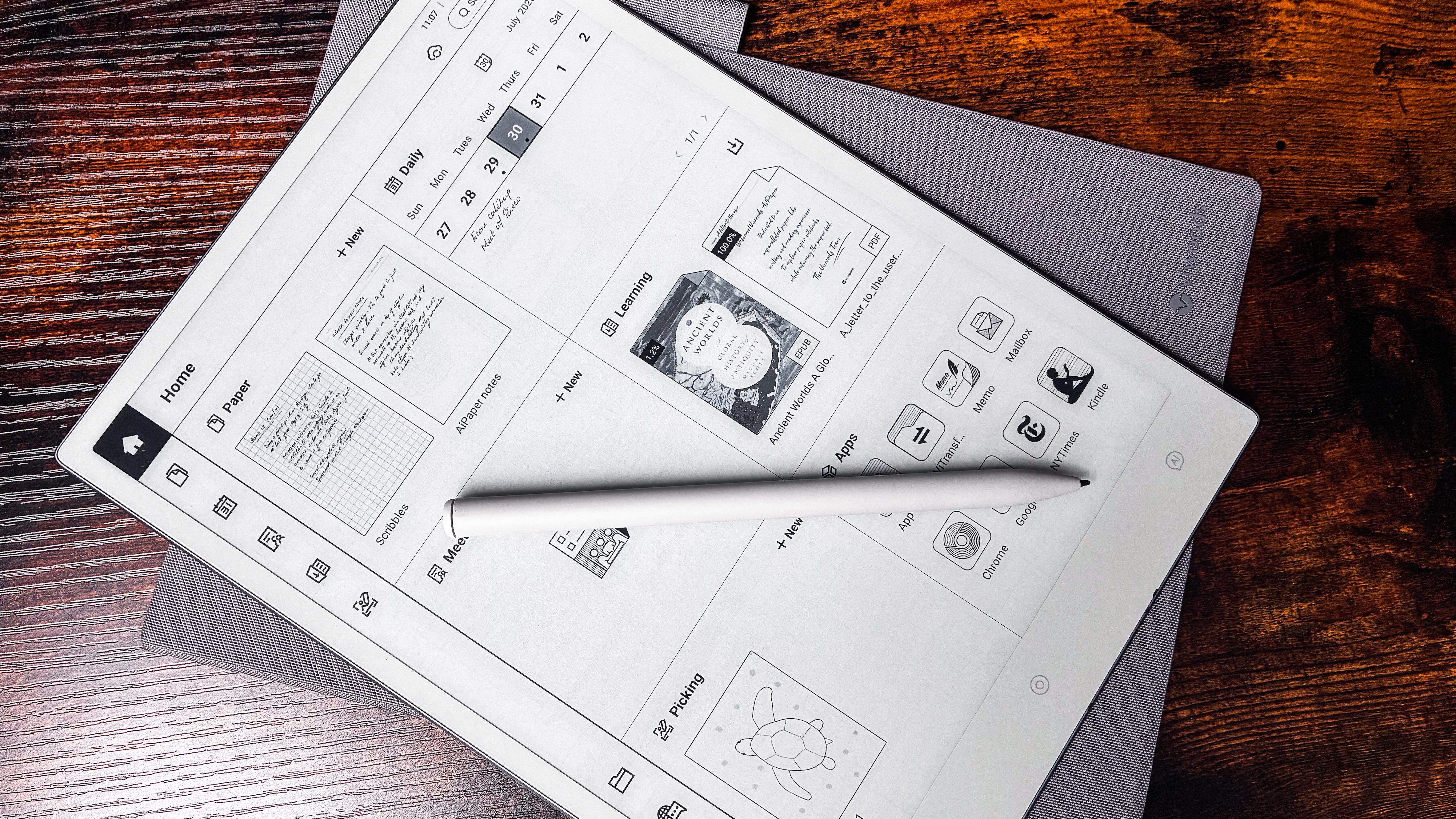 The AiPaper Gen2.5 Stylus Pen lying on top of the homescreen of the ViWoods AiPaper