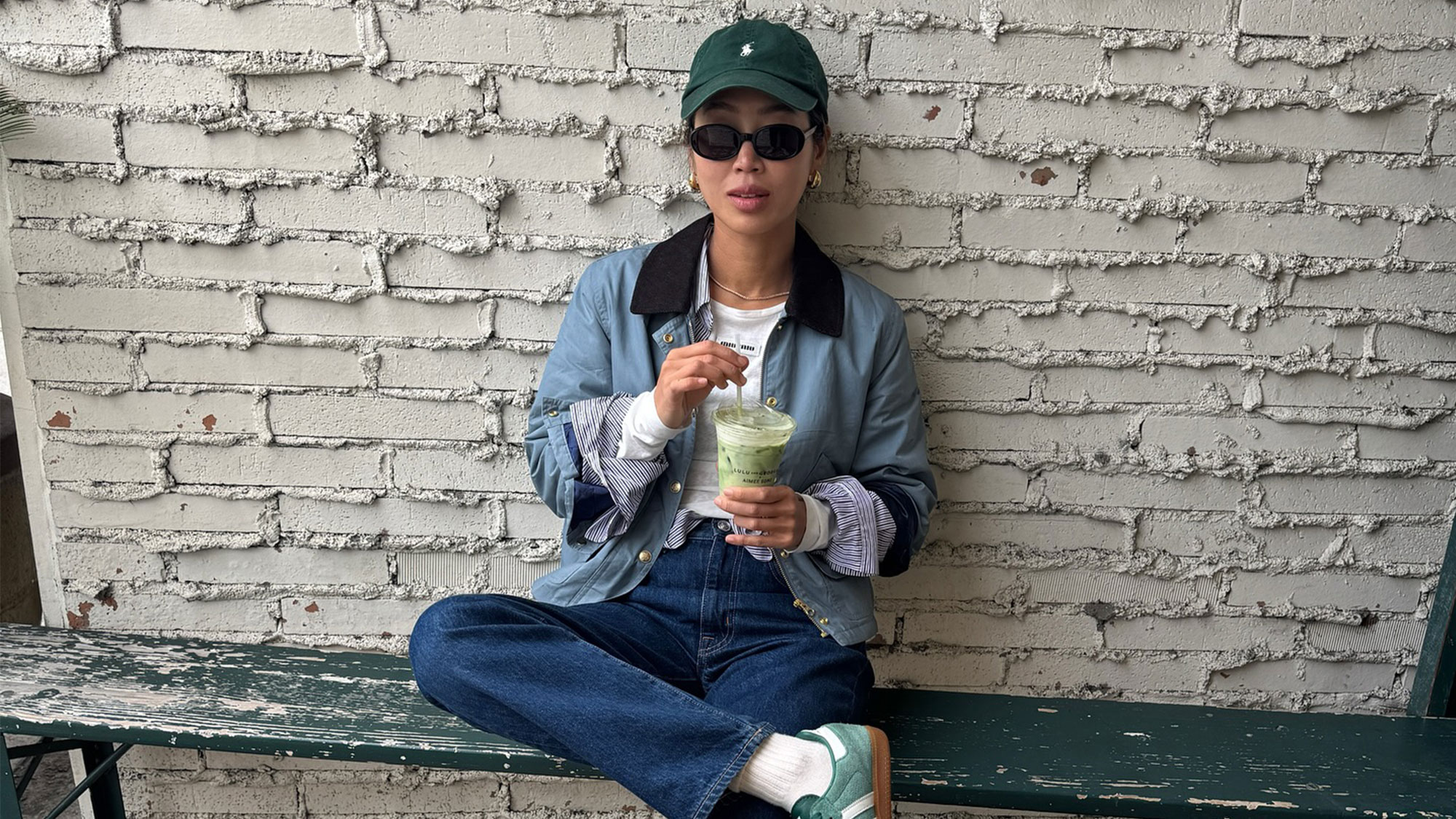 Woman wearing a Polo Ralph Lauren baseball hat.