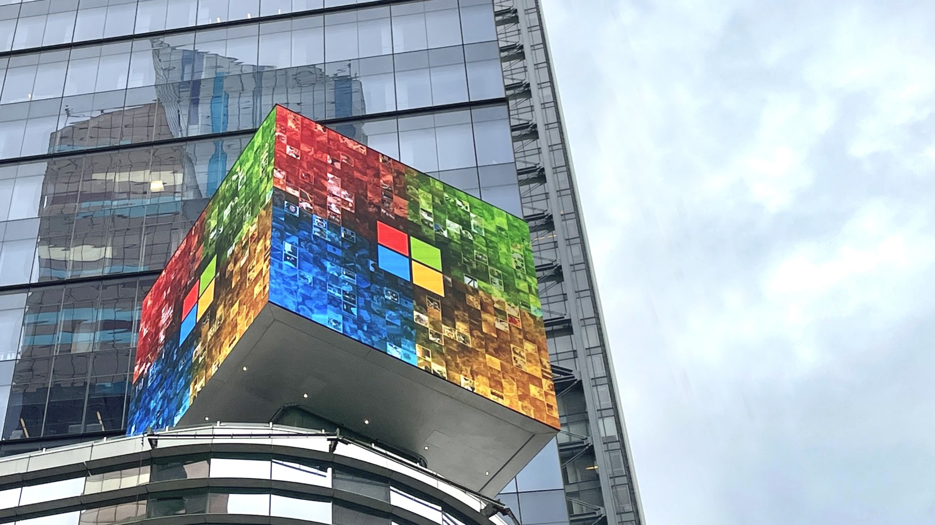 Cube with Microsoft logo on top of its office building on 8th Avenue and 42nd Street near Times Square in New York City.