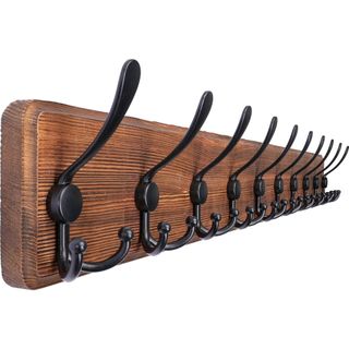 Black hooks on a wooden board