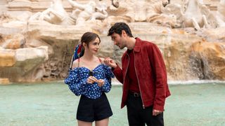 A woman and man stand in front of a fountain in Rome in Emily in Paris season 4 part 2