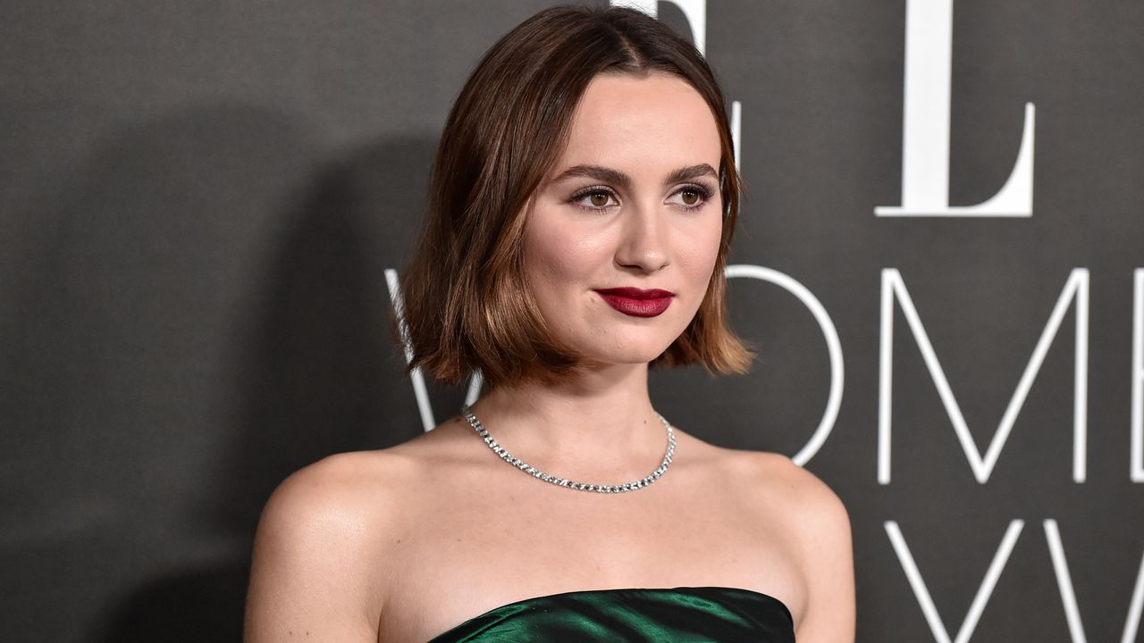 Maude Apatow on red carpet in green dress