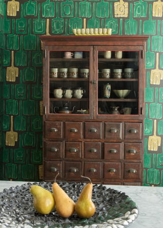 A kitchen with an apothecary cabinet