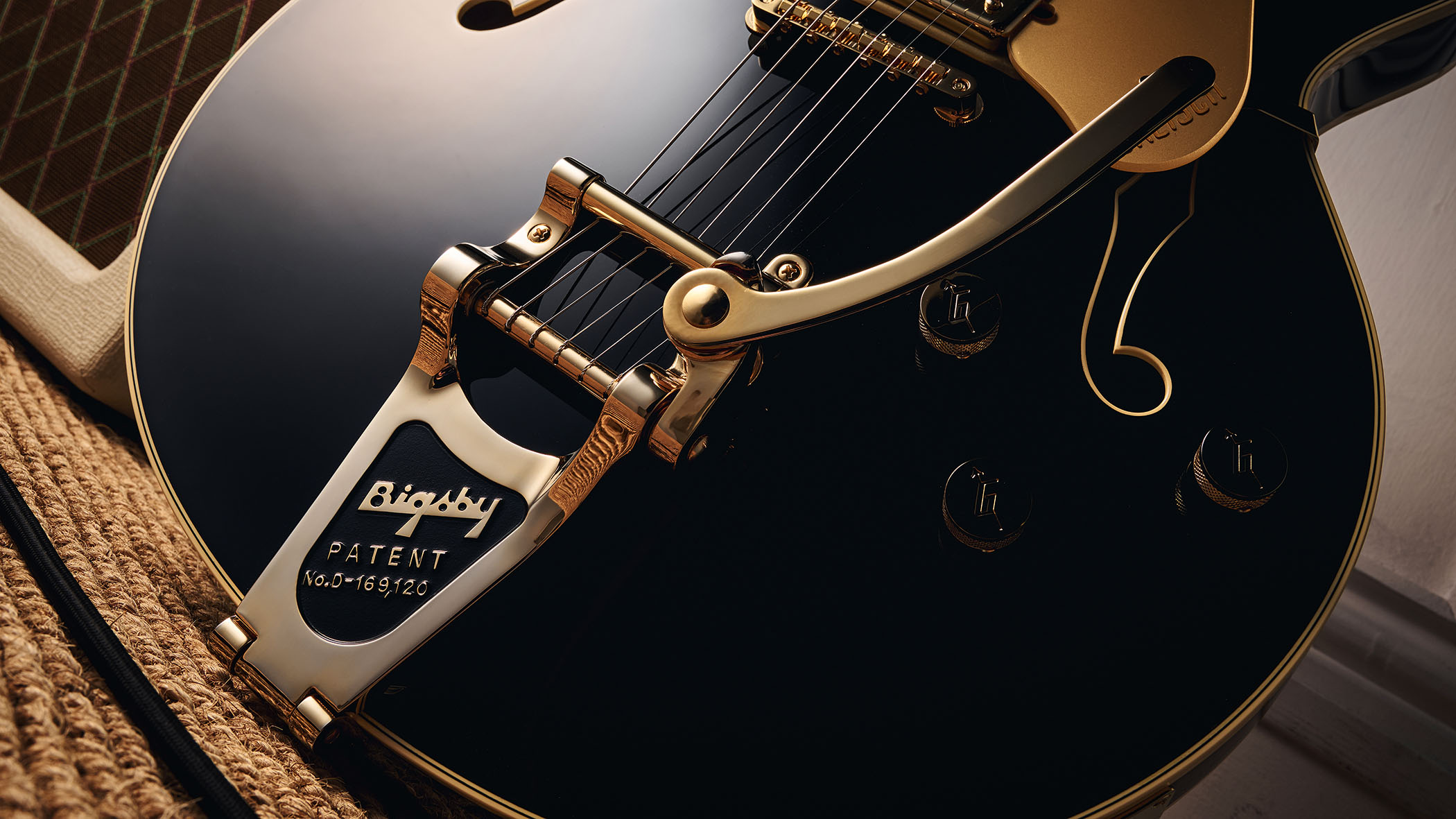 Gretsch Professional Collection Broadkaster LX Center Block: the handsome semi-hollow is finished in black with gold hardware and here is photographed in close-up.