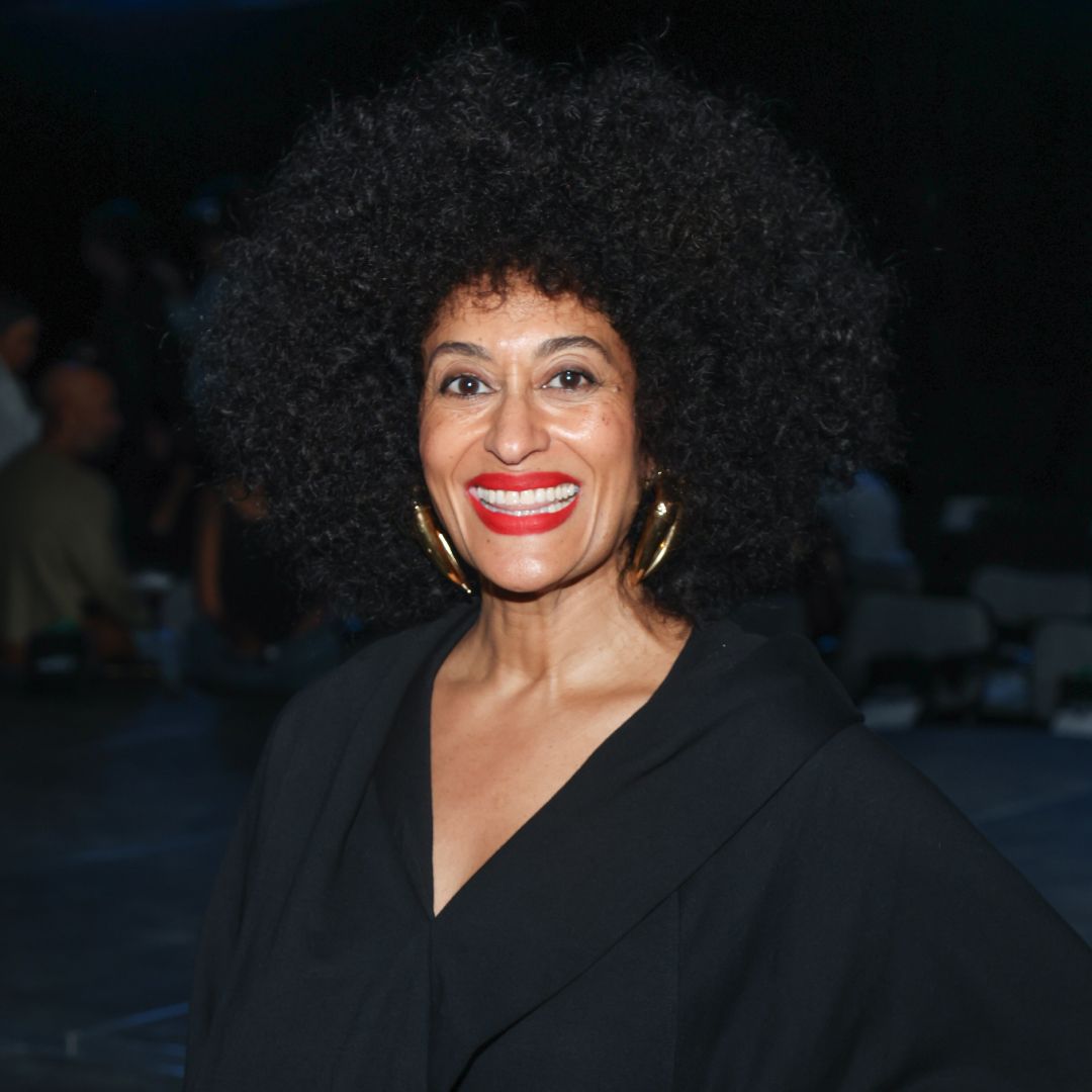 Tracee Ellis Ross wearing red lipstick and her afro hairstyle