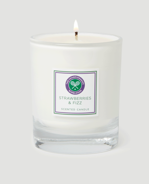 white lit candle on background