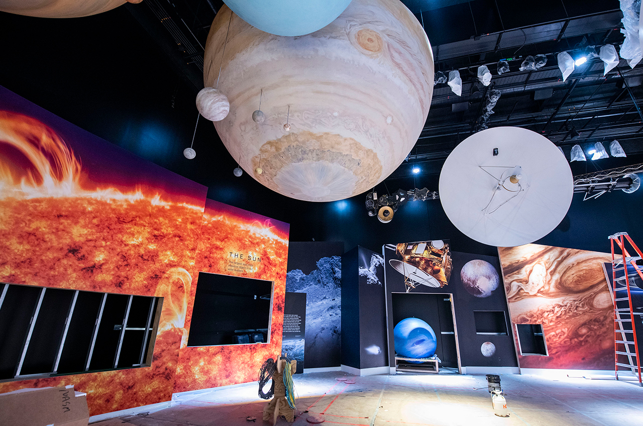 A full-scale mockup of the Voyager interplanetary probe hangs in the reimagined "Kenneth C. Griffin Exploring the Planets" gallery, seen here under construction, at the Smithsonian's National Air and Space Museum in Washington, D.C.