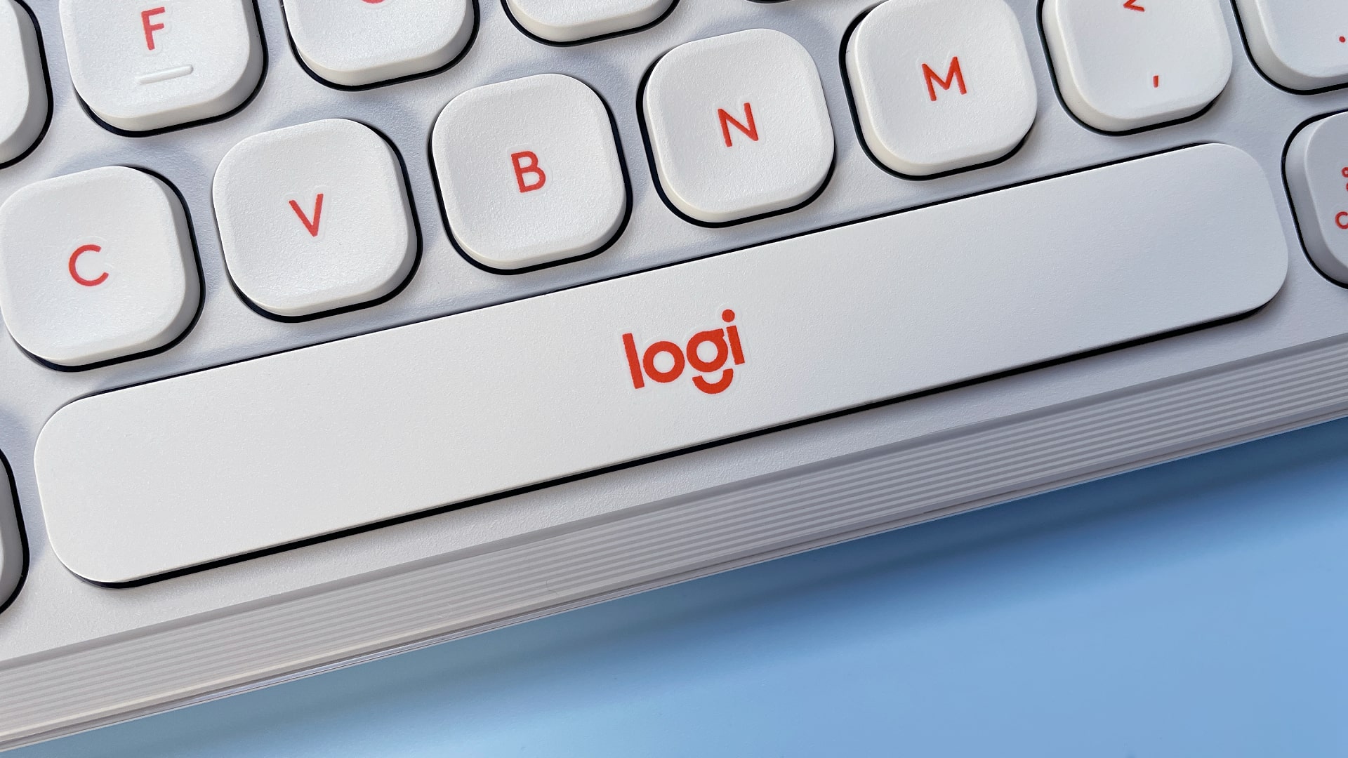 The Logitech POP Icon Keys keyboard against a blue background.