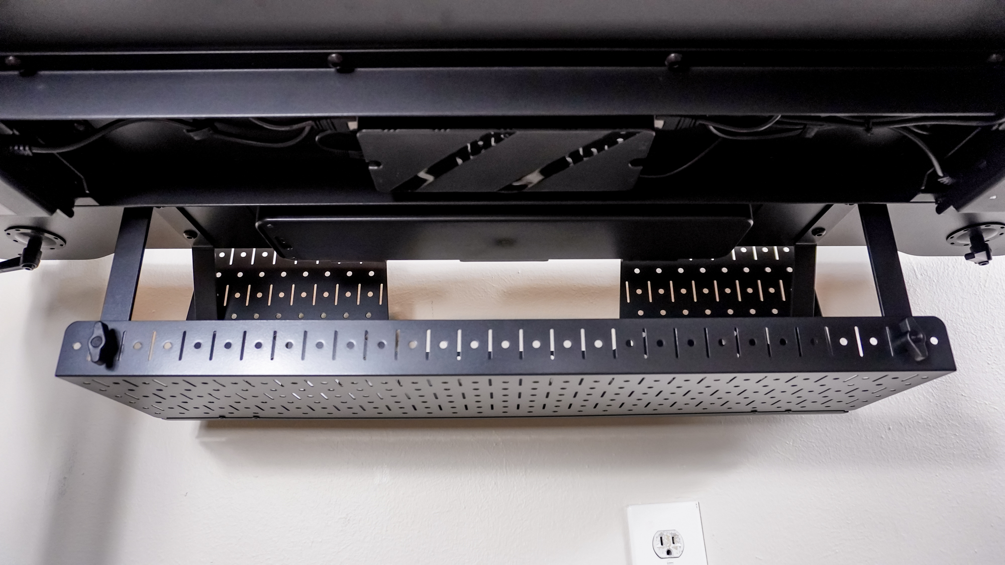 The metal cable management tray that comes included with the Corsair Platform 4: Elevate Desk