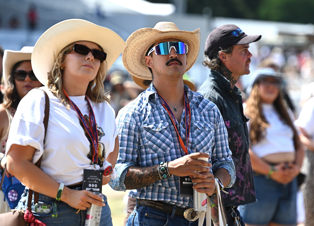 LONDON, ENGLAND - JUNE 28: Two audience members watch Zach Bryan perform on the Great Oak Stage during BST Hyde Park at Hyde Park on June 28, 2025 in London, England.