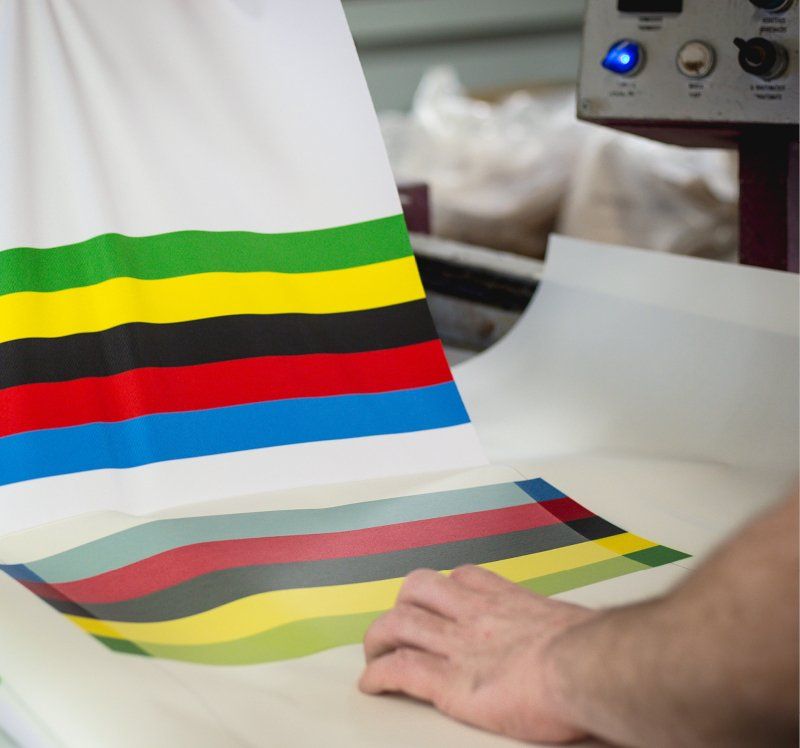 The rainbow bands are printed and then transferred onto the jersey