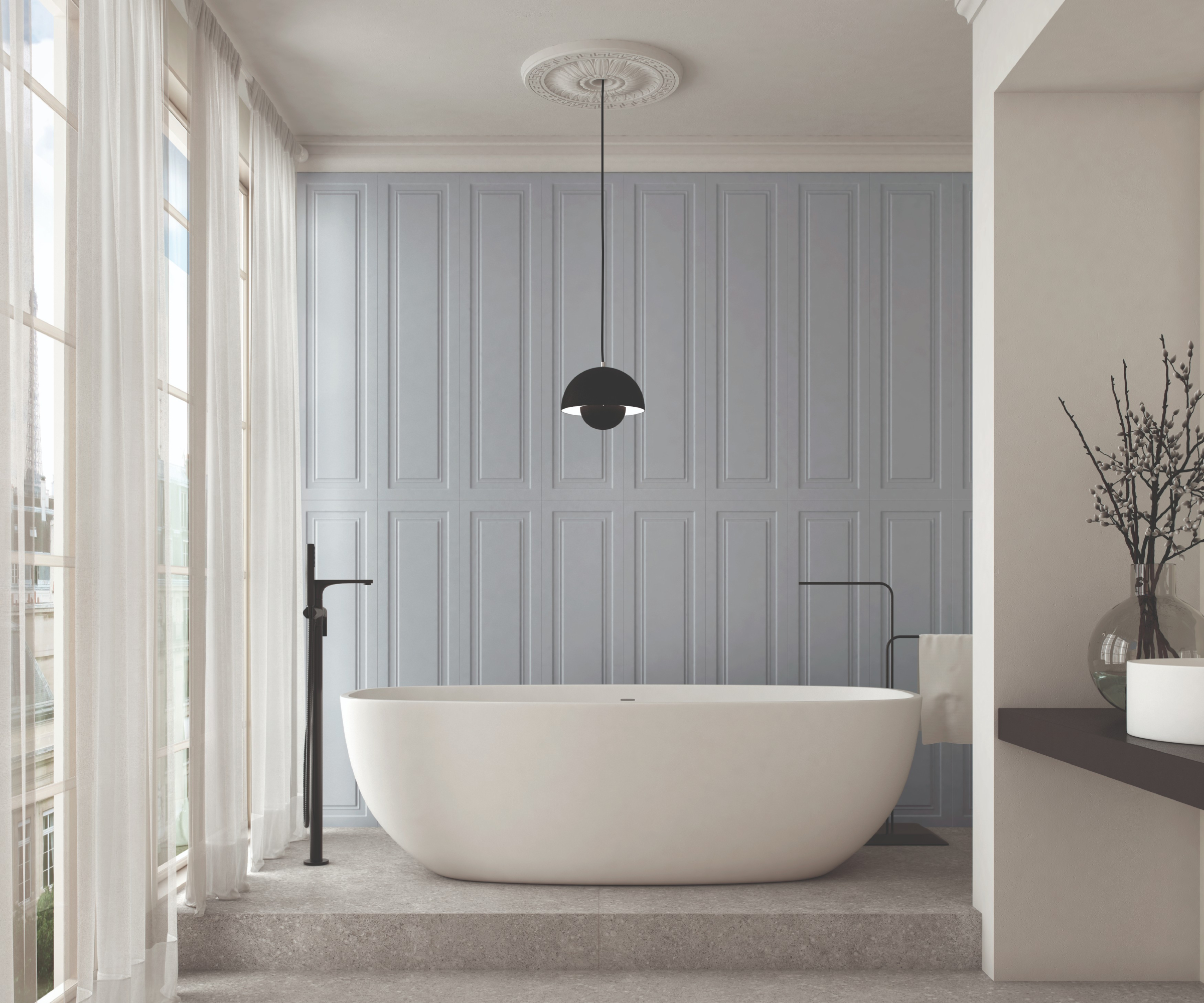blue panelled wall and white freestanding bath
