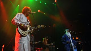 Ibrahim Ag Alhabib (left) and Abdallah Ag Alhousseyni of Tinariwen perform on stage at The Roundhouse on November 16, 2014 in London