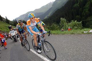 Bradley Wiggins (Garmin-Slipstream) climbs the Col de la Colombière with Lance Armstrong (Astana) on his wheel.