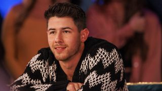Nick Jonas at the judge's table on Dancing with Myself