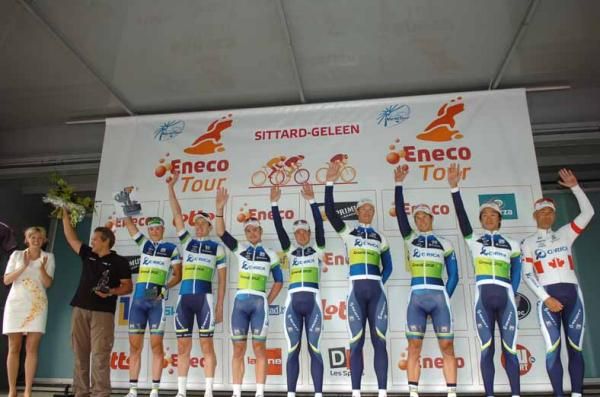 Orica-GreenEdge salute from the podium.
