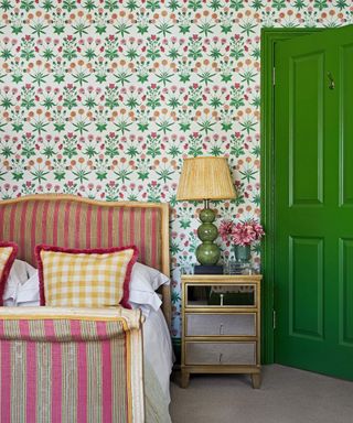 Green bedroom with floral wallpaper