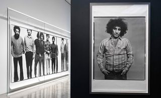 View of a photography installation at Gagosian Gallery featuring a large black and white photo of multiple people and a single black and white photo on the wall