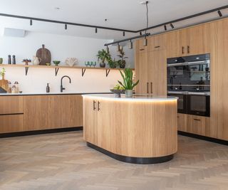 ribbed wooden kitchen with curved kitchen island