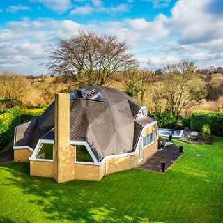 dome house with garden lawn