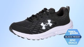 Under Armour Charged Assert 10 running shoe in black against blue background with Tom's Guide deals stamp bottom right