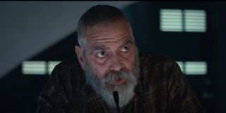 The Midnight Sky George Clooney sitting in front of a microphone, beard and all