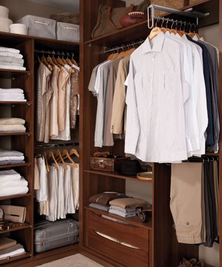 walnut walk-in closet with high level shelving