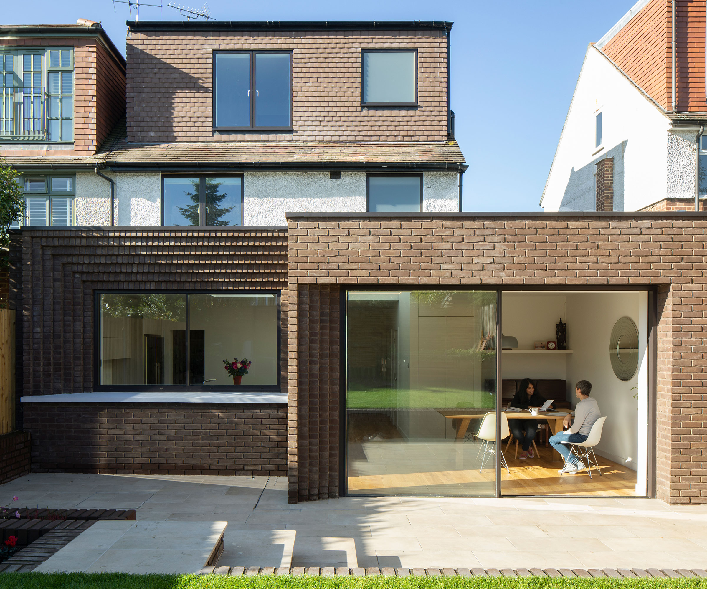 corbelled brick L-shaped extension