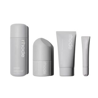Rhode four-piece skincare set in grey packaging.