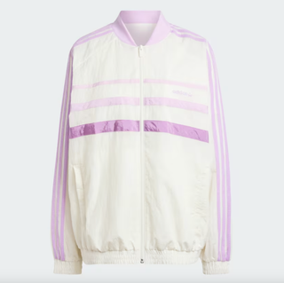 Adidas windbreaker track top on a plain backdrop 