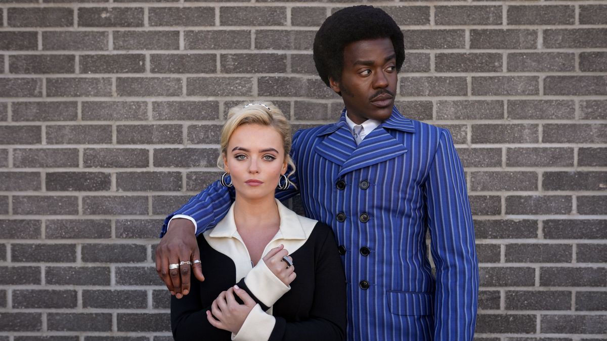 The Doctor (Ncuti Gatwa) in a blue striped suit and Ruby Sunday (Millie Gibson) in 60s-inspired attire in Doctor Who