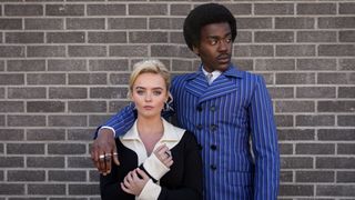 The Doctor (Ncuti Gatwa) in a blue striped suit and Ruby Sunday (Millie Gibson) in 60s-inspired attire in Doctor Who