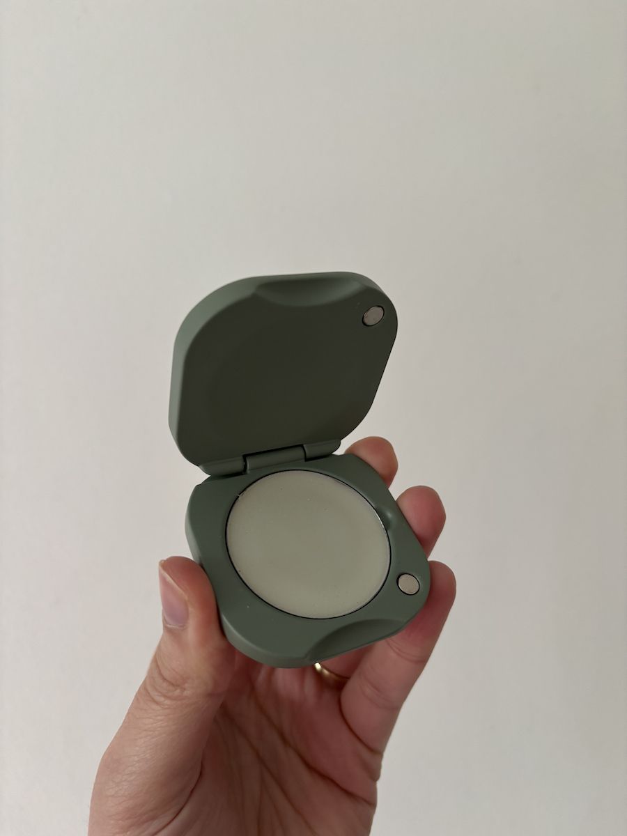 Mica Ricketts holding Tenth Muse Date Night Solid Perfume Balm