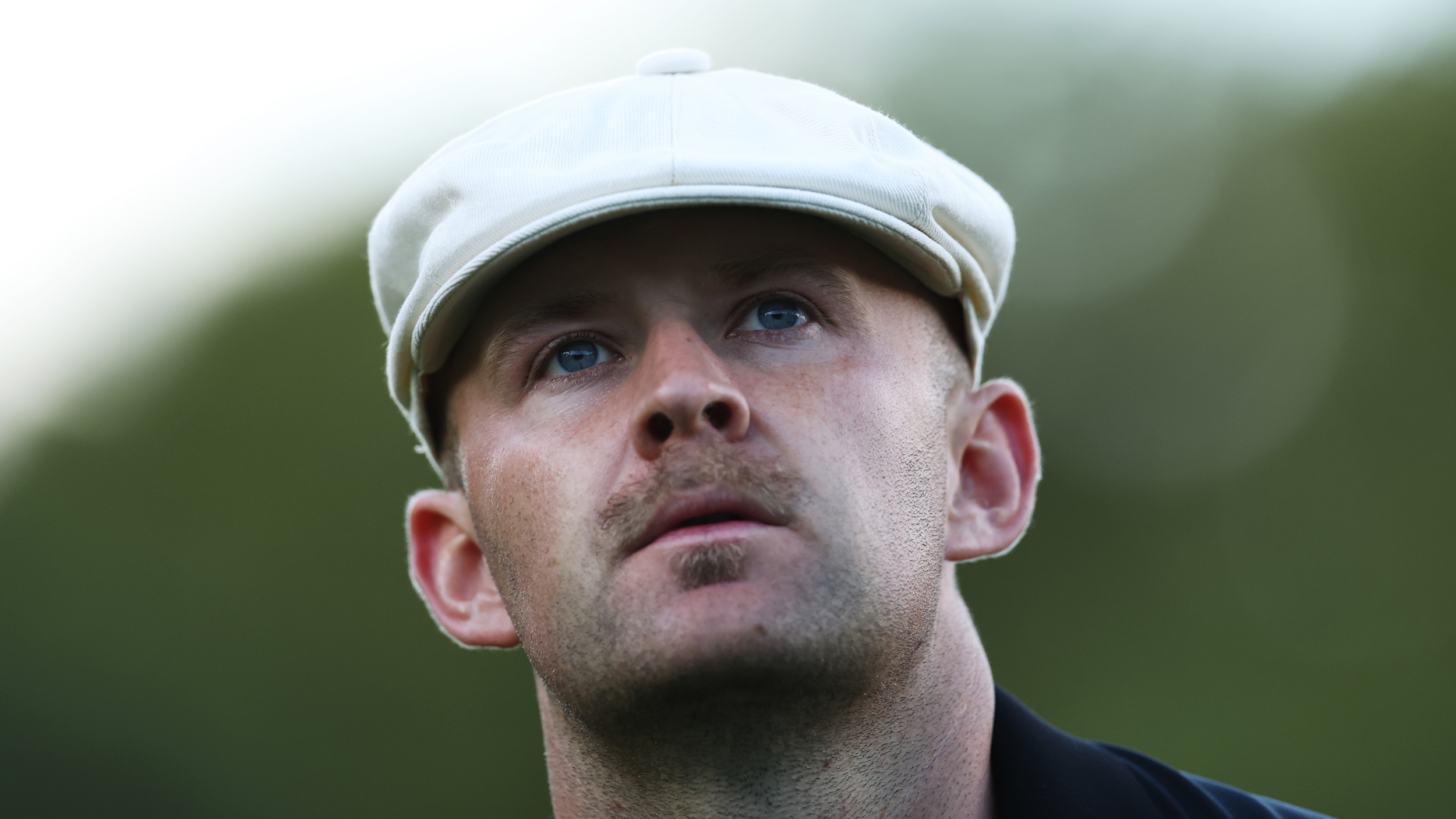 A close-up shot of Harry Hall at the 2025 BMW PGA Championship