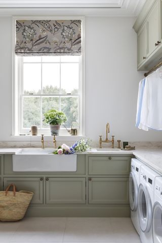 green utility laundry room with belfast sink