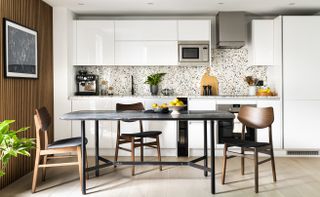 White kitchen with terrazzo backsplash