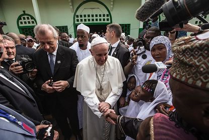 Pope Francis greets children outside of the main mosque in Central African Republic's capital