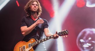 Randy McStine plays a sunburst Les Paul as he performs with Steven Wilson.