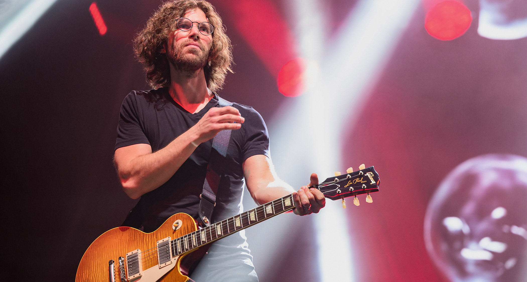 Randy McStine plays a sunburst Les Paul as he performs with Steven Wilson.